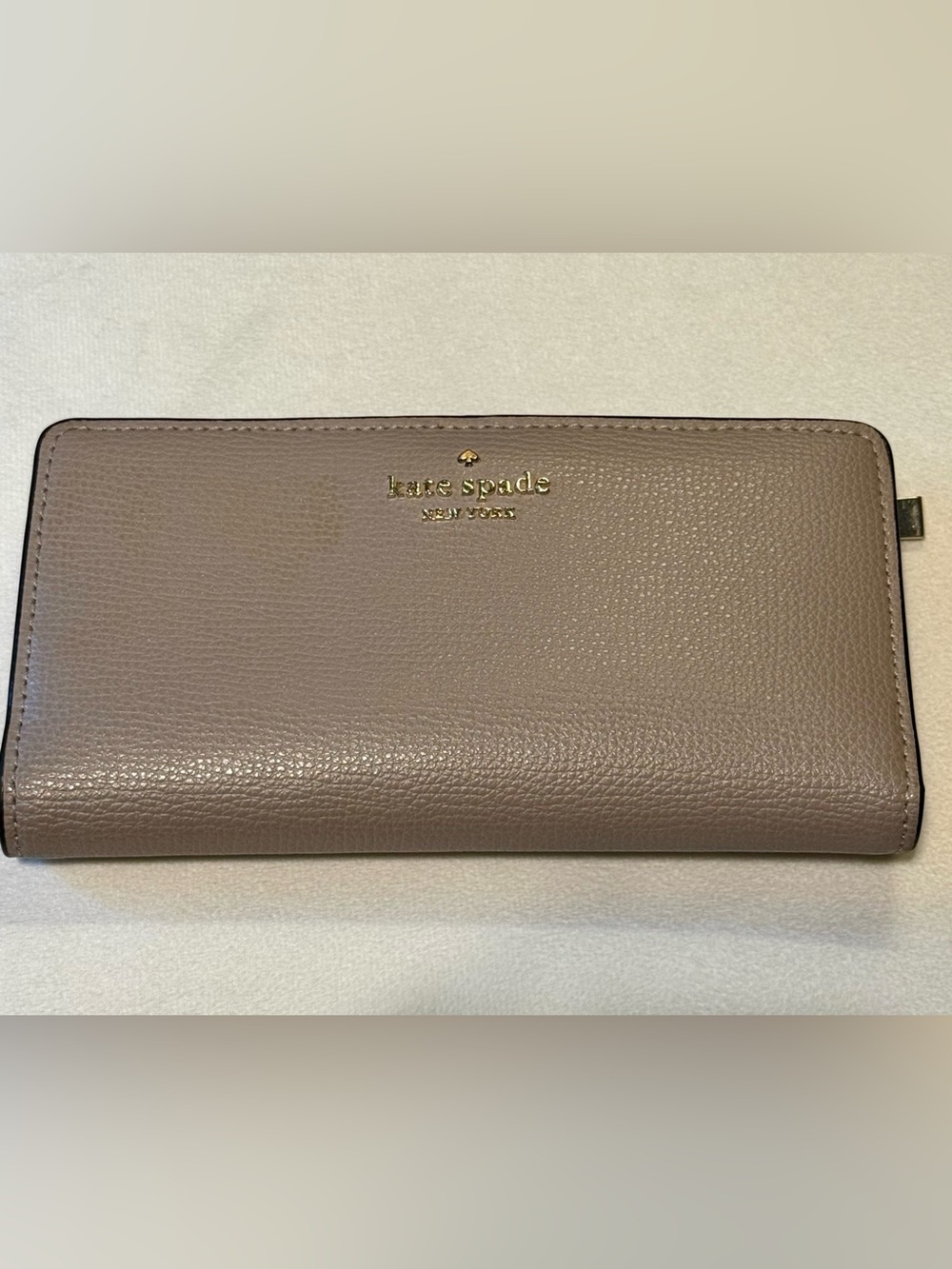 Kate Spade | Darcy Large Slim Bifold Wallet in a Warm Taupe.